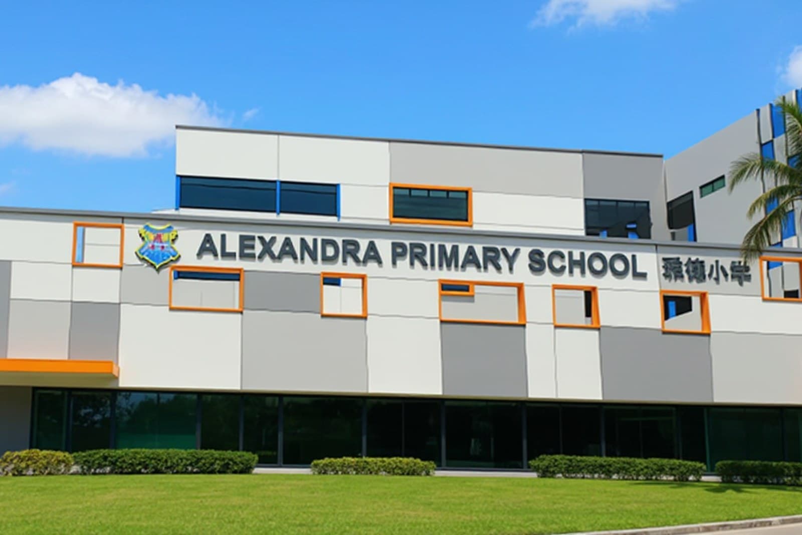 Alexandra Primary School, 350 m from The River Opus Alexandra Primary School, a grey and white building with orange window trim, under a clear blue sky